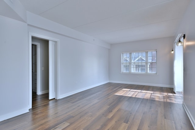 210 N Addison Ave Unit 201, Elmhurst, IL 60126 - empty room with dark wood-style flooring and baseboards