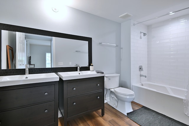 210 N Addison Ave Unit 201, Elmhurst, IL 60126 - bathroom with wood finished floors, vanity, toilet, and shower / washtub combination