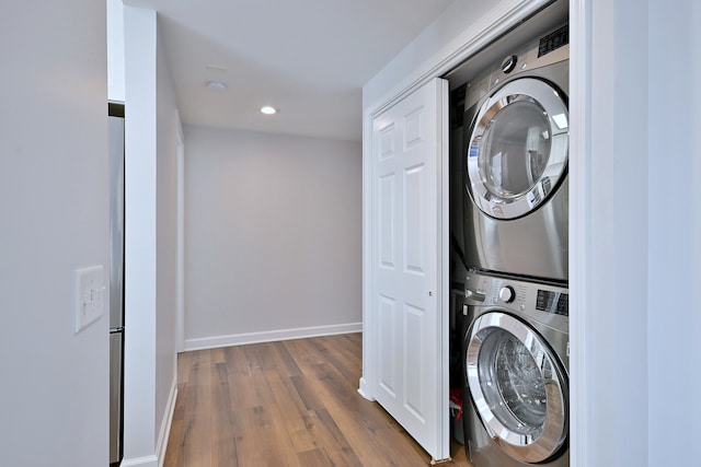 210 N Addison Ave Unit 201, Elmhurst, IL 60126 - washroom with stacked washer / dryer, dark wood-style floors, recessed lighting, and baseboards