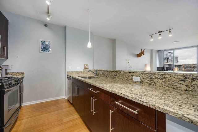 123 S Green St Unit 710B, Chicago, IL 60607 - kitchen featuring rail lighting, stainless steel appliances, a sink, and light wood-type flooring