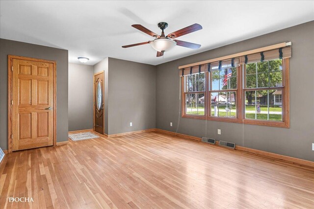 510 W Grant St, Sheridan, IL 60551 - unfurnished room with a ceiling fan and light wood-style floors