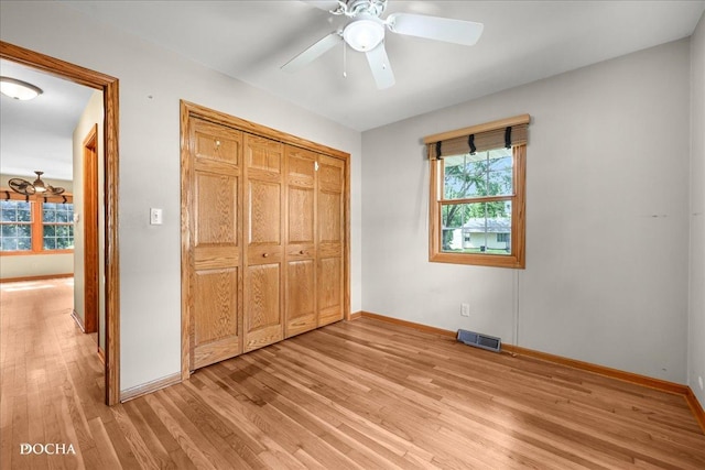 510 W Grant St, Sheridan, IL 60551 - unfurnished bedroom with light wood-type flooring, a closet, and ceiling fan