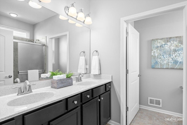 794 Suffield Ct, Oswego, IL 60543 - bathroom featuring double vanity, a shower stall, and tile patterned flooring