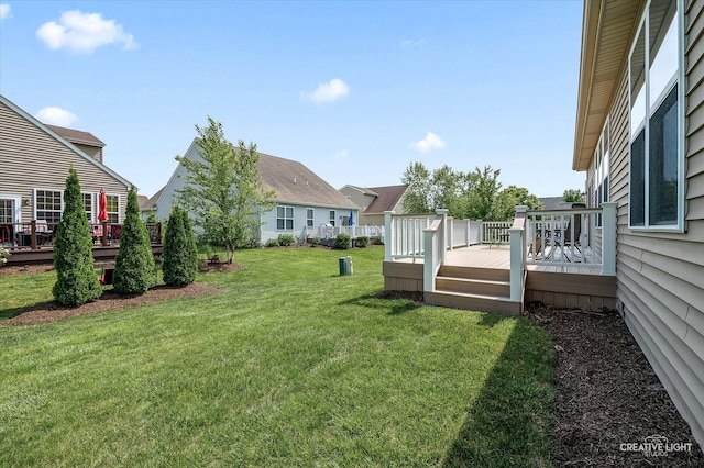 794 Suffield Ct, Oswego, IL 60543 - view of green lawn with a wooden deck and a residential view