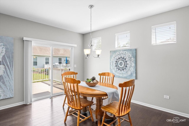 794 Suffield Ct, Oswego, IL 60543 - dining area with a chandelier and dark wood finished floors