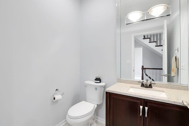 309 Dundee Rd, Barrington, IL 60010 - half bath with toilet, vanity, and baseboards