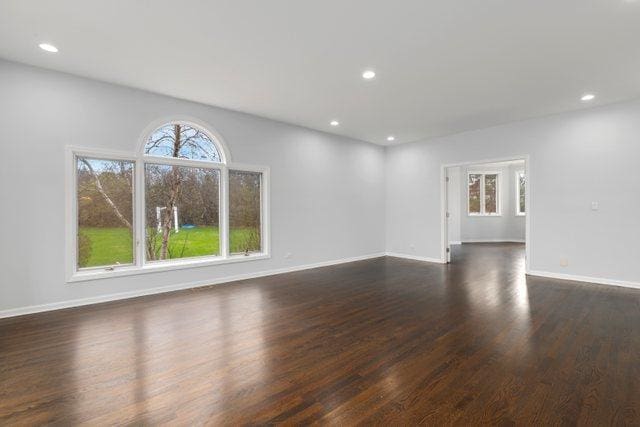 309 Dundee Rd, Barrington, IL 60010 - unfurnished living room with dark wood finished floors, recessed lighting, and baseboards