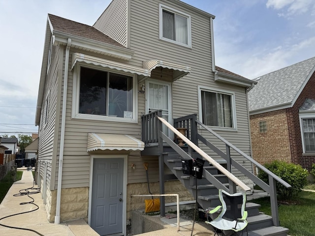 2628 N Mulligan Ave, Chicago, IL 60639 - rear view of house with a shingled roof
