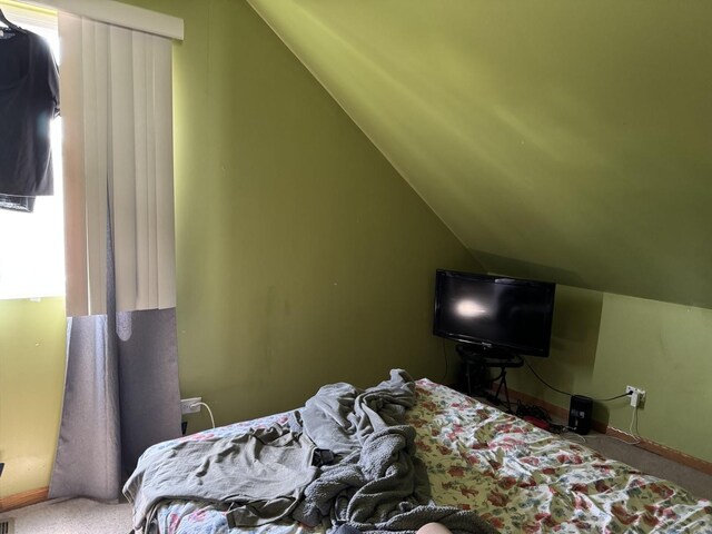2628 N Mulligan Ave, Chicago, IL 60639 - carpeted bedroom with lofted ceiling and baseboards