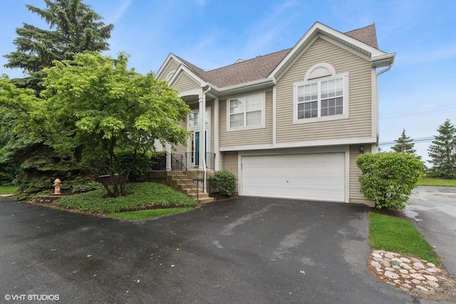 928 S Darla Ct, Waukegan, IL 60085 - view of front of property with asphalt driveway, an attached garage, and a shingled roof