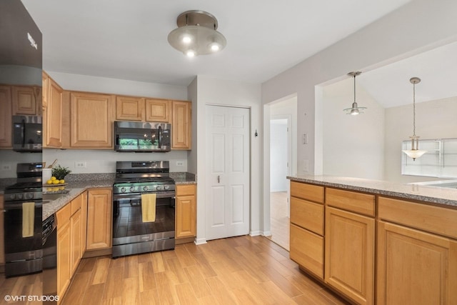 928 S Darla Ct, Waukegan, IL 60085 - kitchen with appliances with stainless steel finishes, light wood-style flooring, light stone counters, and pendant lighting