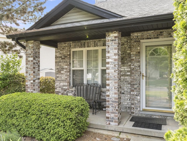 961 Ontario Dr, Romeoville, IL 60446 - view of exterior entry with a porch and brick siding