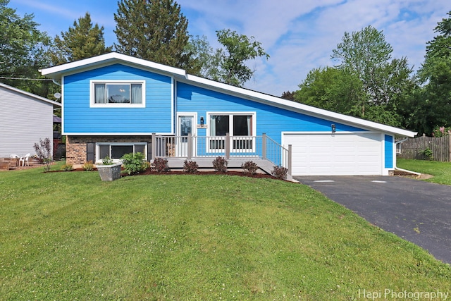 6312 Londonderry Dr, Cary, IL 60013 - tri-level home with a garage, driveway, and brick siding