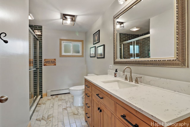 6312 Londonderry Dr, Cary, IL 60013 - bathroom featuring a baseboard radiator, vanity, a stall shower, and toilet