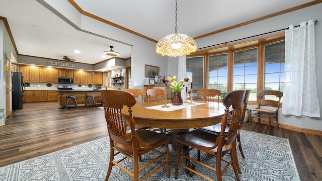 2765 W Pines Rd, Oregon, IL 61061 - dining space featuring ornamental molding, dark wood-type flooring, and baseboards