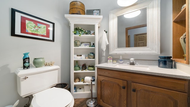 2765 W Pines Rd, Oregon, IL 61061 - half bath with toilet, vanity, and wood finished floors