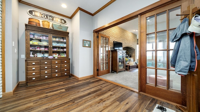 2765 W Pines Rd, Oregon, IL 61061 - entryway with crown molding, wood finished floors, and baseboards