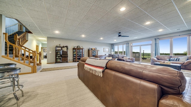 2765 W Pines Rd, Oregon, IL 61061 - living room with carpet floors, stairs, a ceiling fan, and recessed lighting