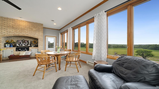 2765 W Pines Rd, Oregon, IL 61061 - carpeted dining space with ornamental molding, healthy amount of natural light, a baseboard heating unit, recessed lighting, and baseboards