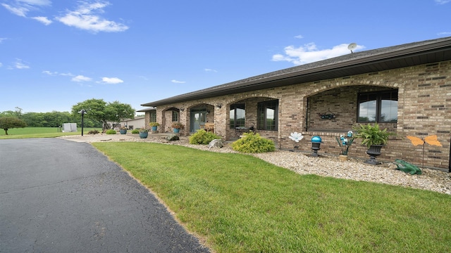 2765 W Pines Rd, Oregon, IL 61061 - view of front of home featuring brick siding and a front yard