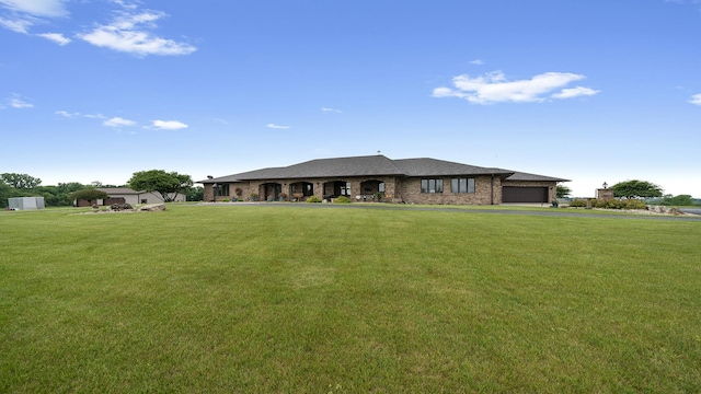 2765 W Pines Rd, Oregon, IL 61061 - view of front of home featuring an attached garage, a front lawn, and brick siding