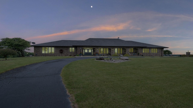 2765 W Pines Rd, Oregon, IL 61061 - view of front facade featuring a lawn, brick siding, and curved driveway