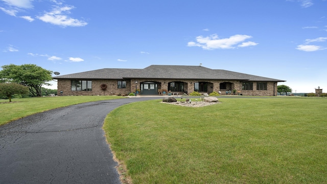 2765 W Pines Rd, Oregon, IL 61061 - view of front of property with brick siding, a front yard, and curved driveway