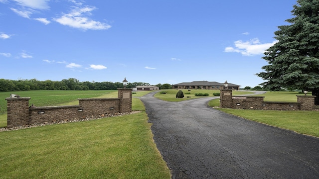2765 W Pines Rd, Oregon, IL 61061 - view of asphalt driveway featuring street lights