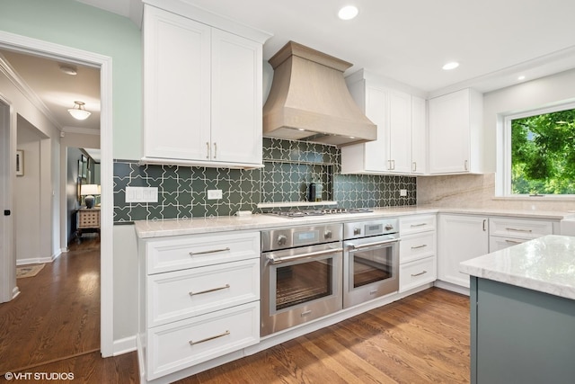 25801 Twin Pond Rd, Lake Barrington, IL 60010 - kitchen with custom exhaust hood, appliances with stainless steel finishes, white cabinets, crown molding, and recessed lighting