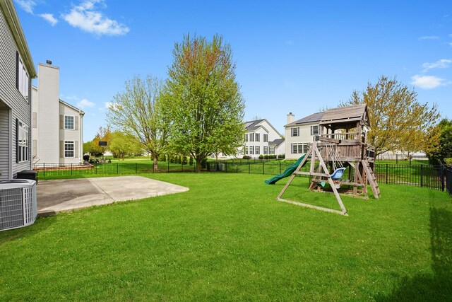 2045 Bonita Ln, Hoffman Estates, IL 60192 - view of yard featuring a playground, a patio area, and central air condition unit