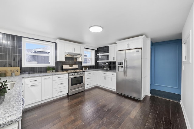 4322 Amelia Ave, Lyons, IL 60534 - kitchen with appliances with stainless steel finishes, under cabinet range hood, backsplash, and dark wood finished floors