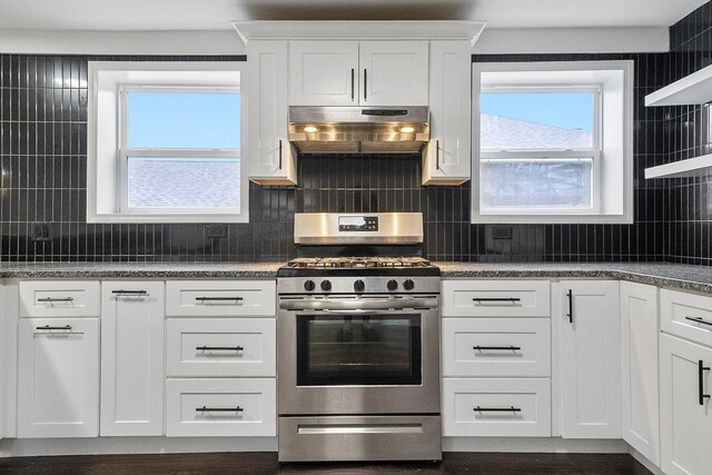 4322 Amelia Ave, Lyons, IL 60534 - kitchen with stainless steel gas range, under cabinet range hood, white cabinetry, and backsplash