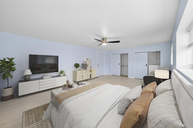 4322 Amelia Ave, Lyons, IL 60534 - bedroom with two closets, light wood-type flooring, and a ceiling fan