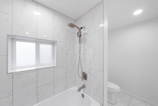 4322 Amelia Ave, Lyons, IL 60534 - bathroom with washtub / shower combination, toilet, marble look tile flooring, and baseboards