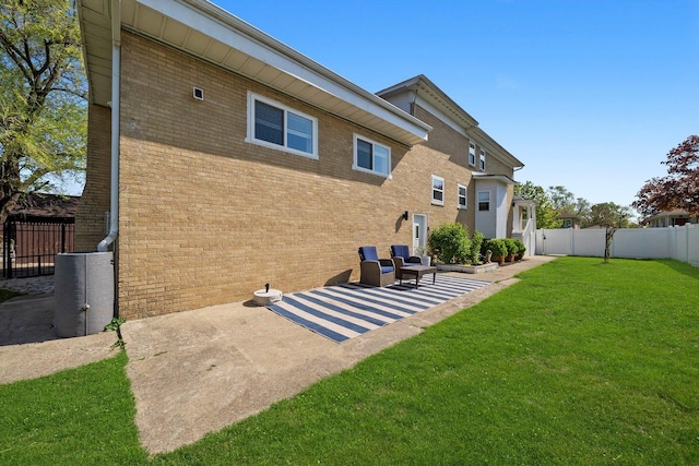 4322 Amelia Ave, Lyons, IL 60534 - rear view of property featuring brick siding and a patio area