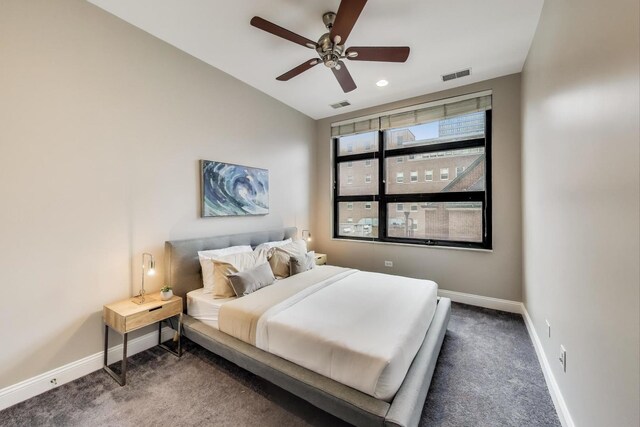 101 W Superior St Unit 501, Chicago, IL 60654 - bedroom with baseboards, dark colored carpet, and a ceiling fan