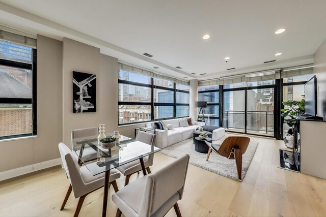 101 W Superior St Unit 501, Chicago, IL 60654 - dining room with light wood finished floors, recessed lighting, and baseboards