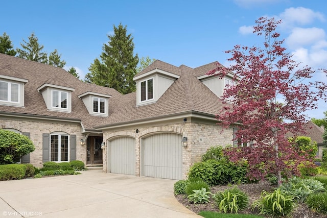 6 Tartan Ridge Rd, Burr Ridge, IL 60527 - view of front facade with concrete driveway, roof with shingles, and a garage