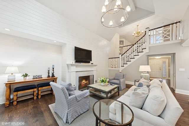 6 Tartan Ridge Rd, Burr Ridge, IL 60527 - living room featuring a chandelier, wood finished floors, a lit fireplace, high vaulted ceiling, and baseboards