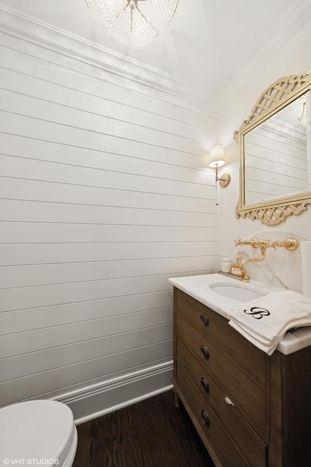6 Tartan Ridge Rd, Burr Ridge, IL 60527 - half bathroom featuring vanity, wood finished floors, crown molding, toilet, and baseboards