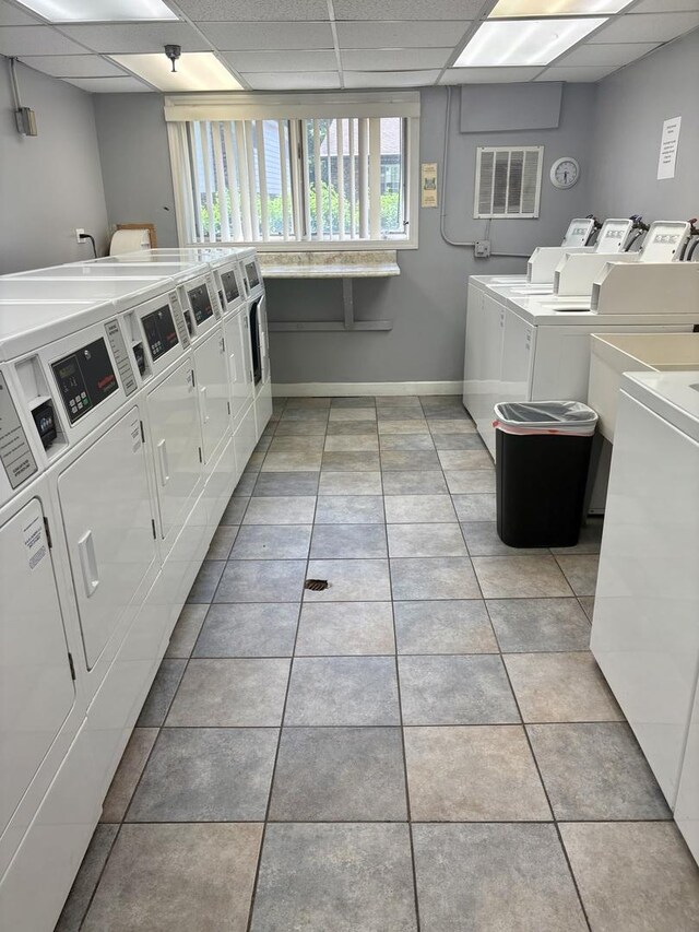 5501 Lincoln Ave Unit 405, Morton Grove, IL 60053 - community laundry room featuring separate washer and dryer and light tile patterned flooring