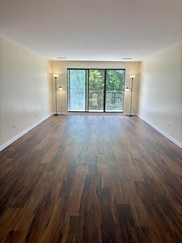 5501 Lincoln Ave Unit 405, Morton Grove, IL 60053 - unfurnished room featuring dark wood-style floors and baseboards