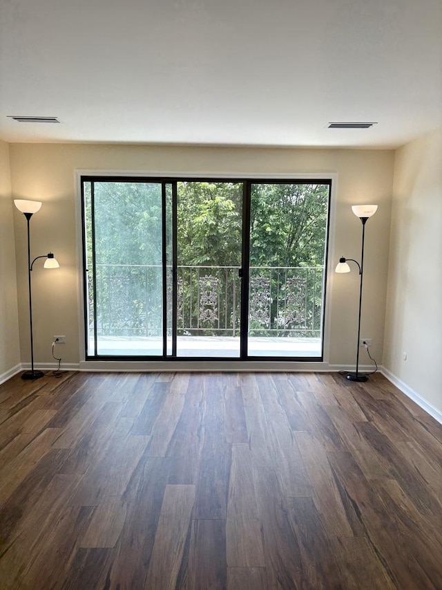5501 Lincoln Ave Unit 405, Morton Grove, IL 60053 - unfurnished room featuring wood finished floors and baseboards