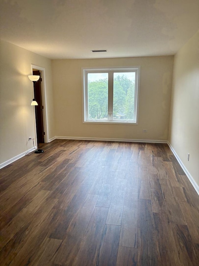 5501 Lincoln Ave Unit 405, Morton Grove, IL 60053 - empty room with dark wood-style flooring and baseboards