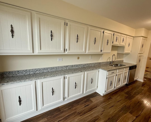 5501 Lincoln Ave Unit 405, Morton Grove, IL 60053 - kitchen with stainless steel dishwasher, white cabinets, light stone countertops, and dark wood-type flooring