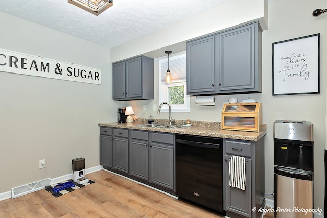 155 Shadowbrook Dr, Capron, IL 61012 - kitchen with black dishwasher, a sink, light wood finished floors, gray cabinets, and baseboards