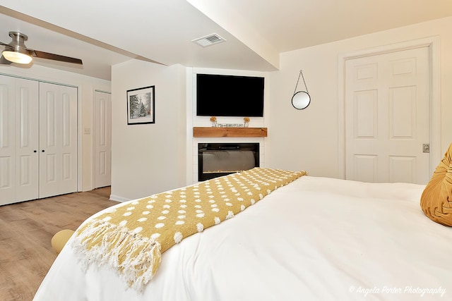 155 Shadowbrook Dr, Capron, IL 61012 - bedroom featuring wood finished floors and a glass covered fireplace
