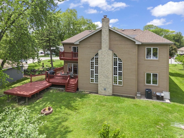 5N311 Lloyd Ave, Itasca, IL 60143 - rear view of property featuring an outdoor fire pit, a chimney, a yard, a deck, and a patio area