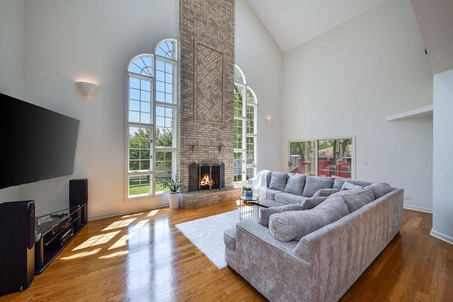 5N311 Lloyd Ave, Itasca, IL 60143 - living area with high vaulted ceiling, a fireplace, and wood finished floors