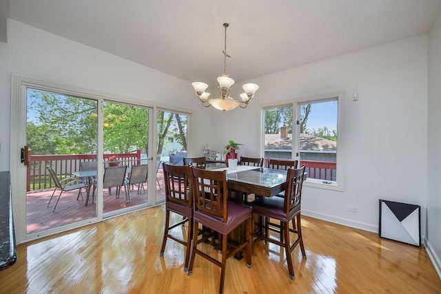 5N311 Lloyd Ave, Itasca, IL 60143 - dining area featuring a chandelier, light wood-type flooring, and healthy amount of natural light